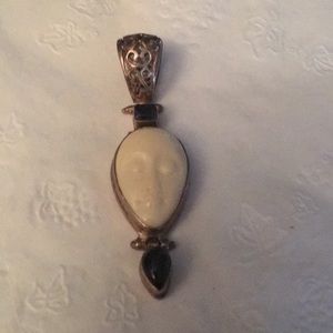 Boneface, sapphire and black onyx stones